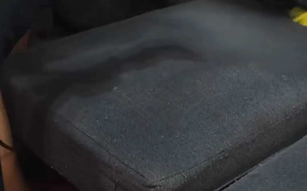 Brush agitation and clear-head extraction stripes on charcoal fabric